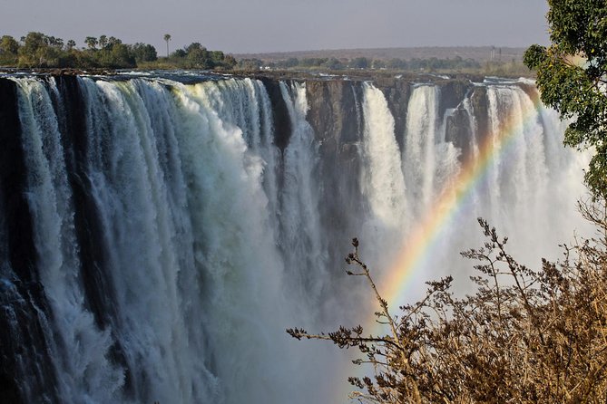 5 Day Victoria Falls and Chobe National Park Luxury Accommodated Tour - Day one: airport pickup, sunset water, and Mosi-oa-Tunya