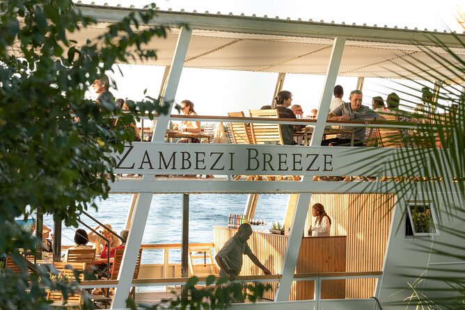 Dinner Cruise on the Zambezi River - Sunset Views and the Distant Falls Mist