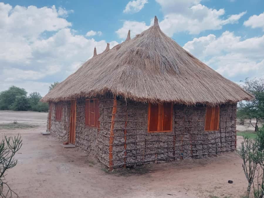 Livingstone: Amazing Traditional Village Tour - Walking through traditional Lozi buildings