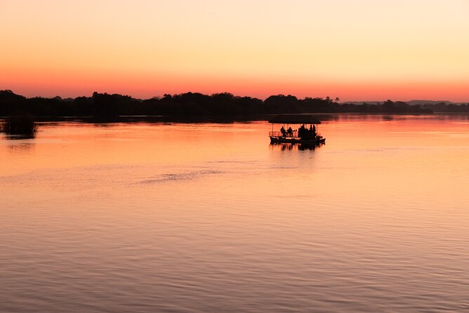 Private Sunset Cruise on the Zambezi River - The crew makes the small boat work