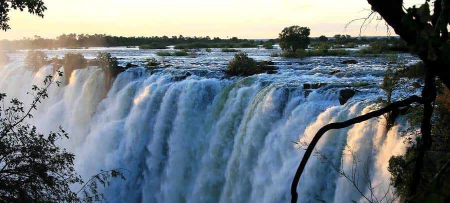 Victoria Falls Guided Tour Plus Lunch & Transport - Starting with hotel pickup in an air-conditioned vehicle