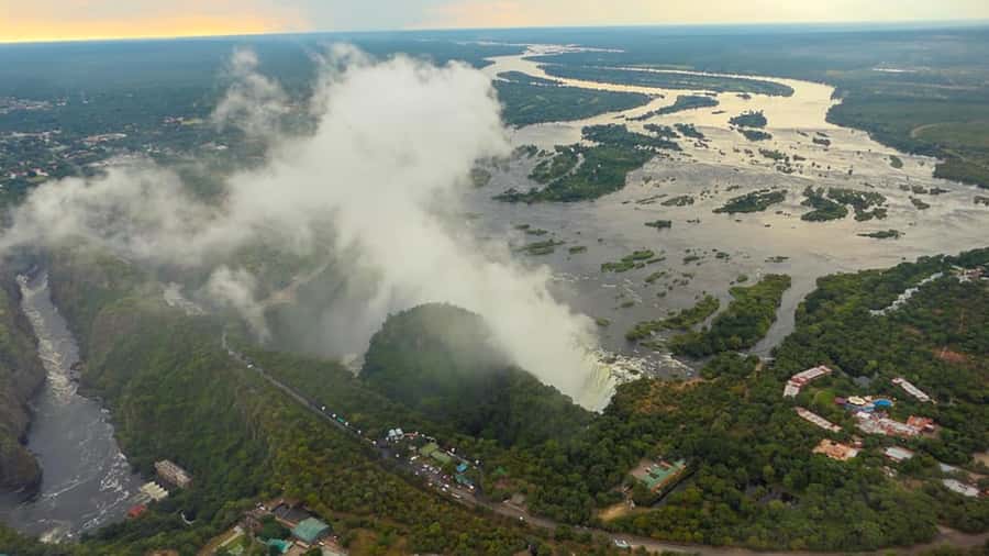 Victoria Falls: Helicopter Flight Aerial View of The Falls - Taking Off Above the Zambezi River