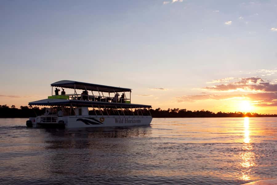 Zimbabwe: Sundowner Cruise (Standard) Zambezi River - Boarding the boat and settling into the river